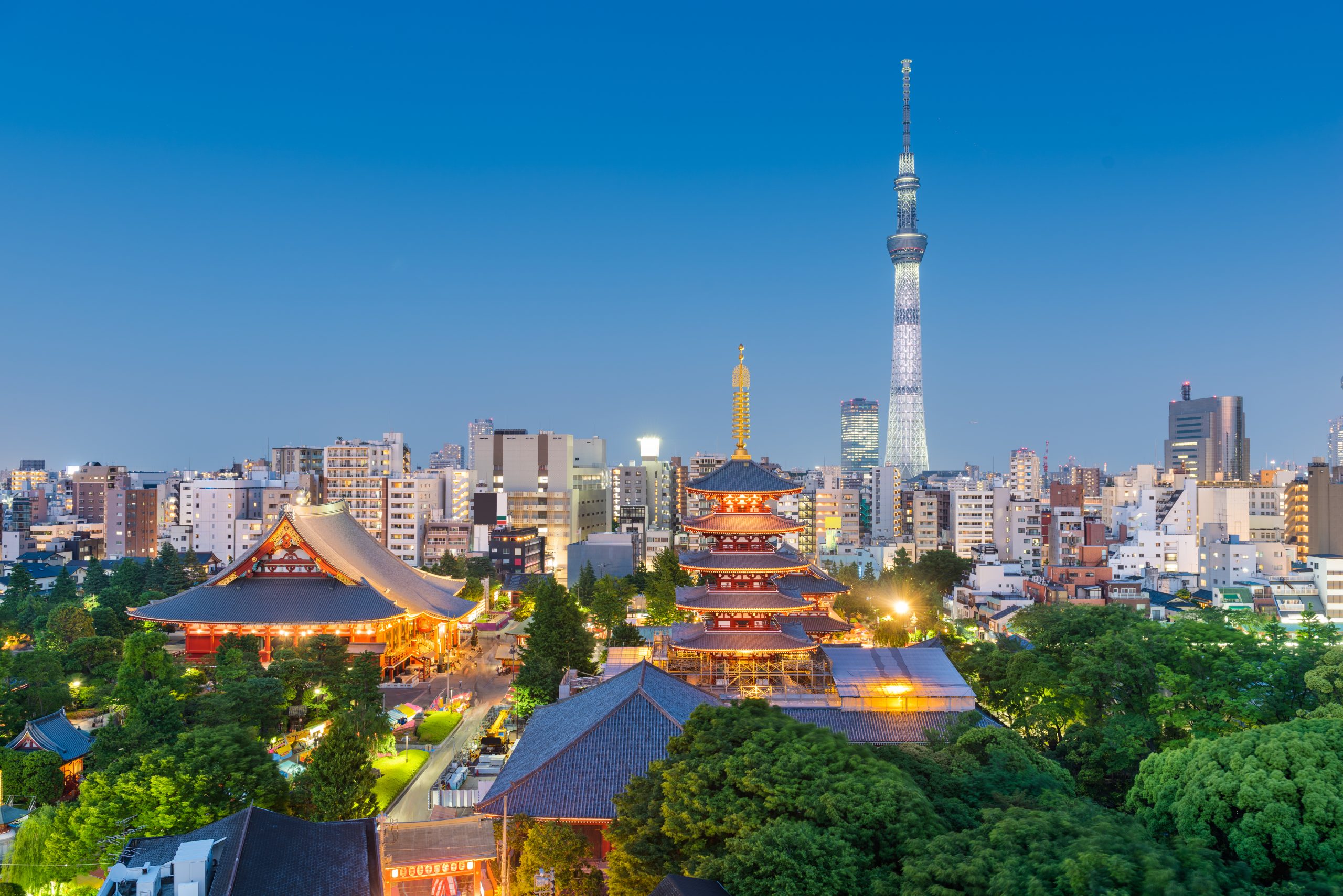 Tokyo, Japan skyline and towers in Asakusa at night.